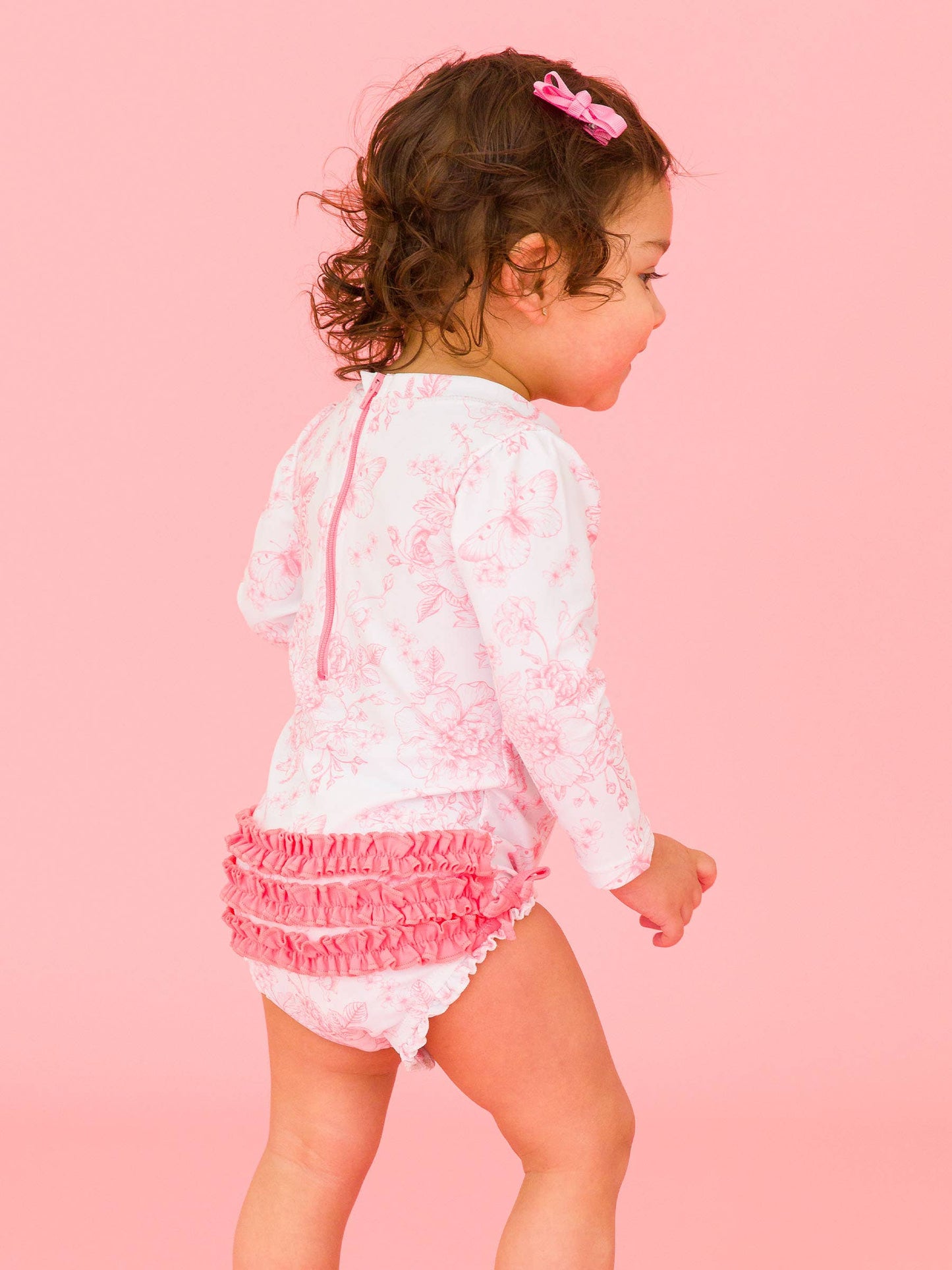 RuffleButts + RuggedButts - Baby Girls Bubblegum Pink Butterfly Garden Toile One Piece Rash Guard