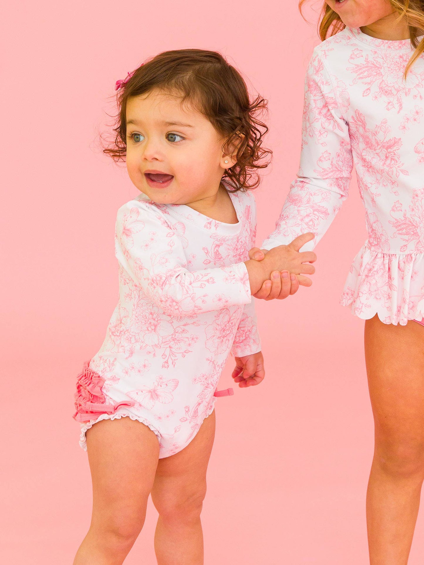 RuffleButts + RuggedButts - Baby Girls Bubblegum Pink Butterfly Garden Toile One Piece Rash Guard