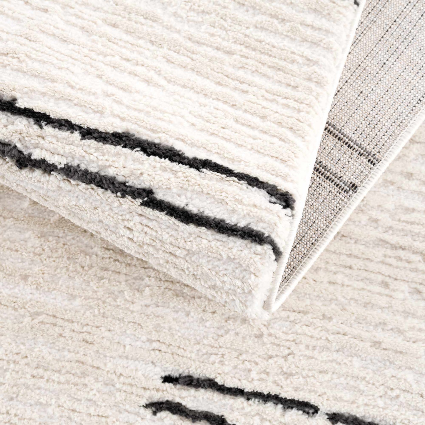 Riad Black Striped White Area Rug with tassels