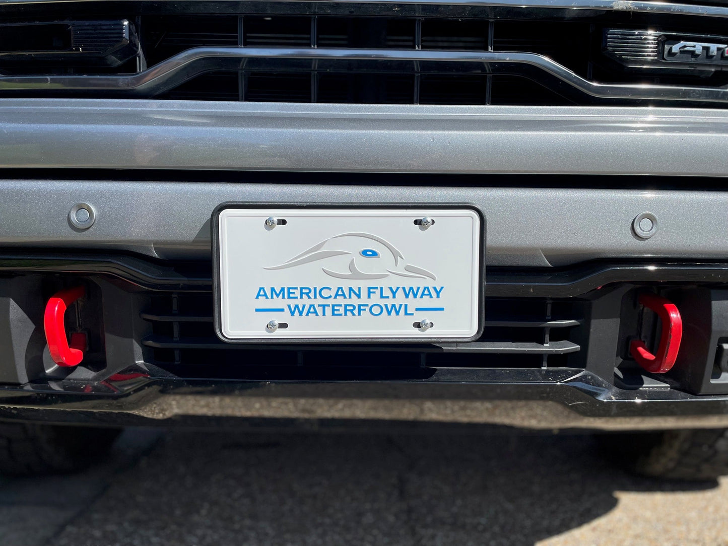 White / Blue Eye AFW Logo License Plate